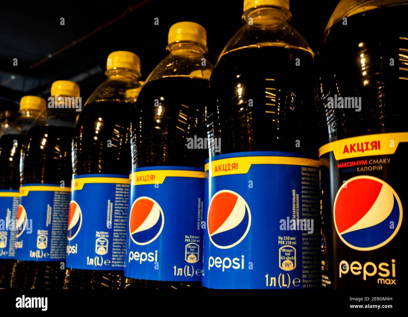 Pepsi bottles seen on a supermarket shelf. Pepsi is a carbonated soft