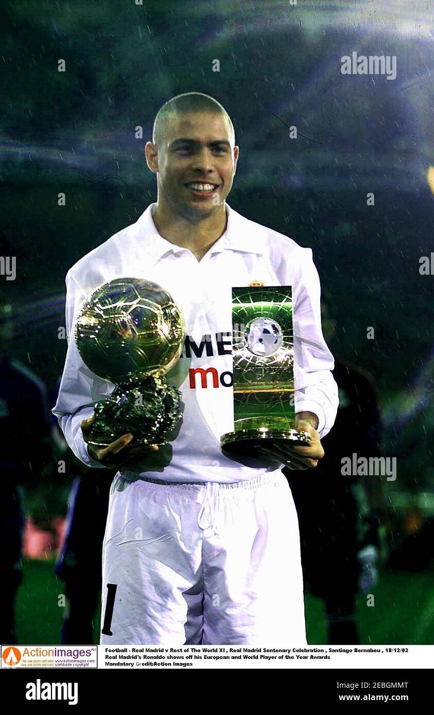 Football - Real Madrid v Rest of The World XI , Real Madrid Sentenary Celebration , Santiago Bernabeu , 18/12/02  Real Madrid's Ronaldo shows off his European and World Player of the Year Awards  Mandatory Credit:Action Images Stock Photo
