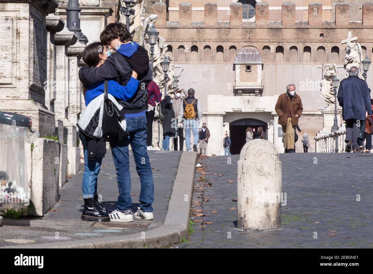 Rome, Italy. 11th Feb, 2021. A boy and a girl kiss in front of Castel ...