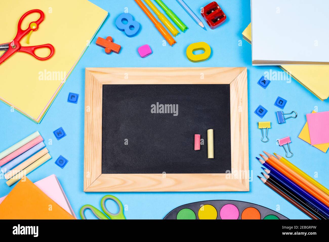 Back to school flat lay composition with blackboard. School supplies ...