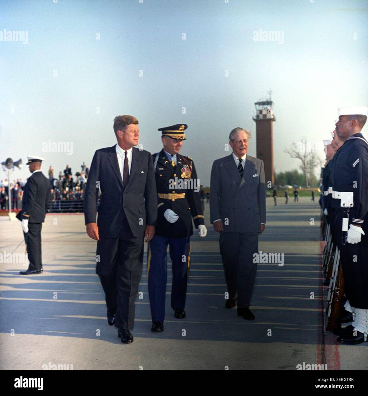 Arrival ceremonies for Harold Macmillan, Prime Minister of Great Britain, 4:50PM. Commander of Troops, Lieutenant Colonel Charles P. Murray, Jr. (center), escorts President John F. Kennedy and Prime Minister of Great Britain, Harold Macmillan, past the United States Navy Honor Guard during arrival ceremonies for Prime Minister Macmillan. Andrews Air Force Base, Maryland. Stock Photo
