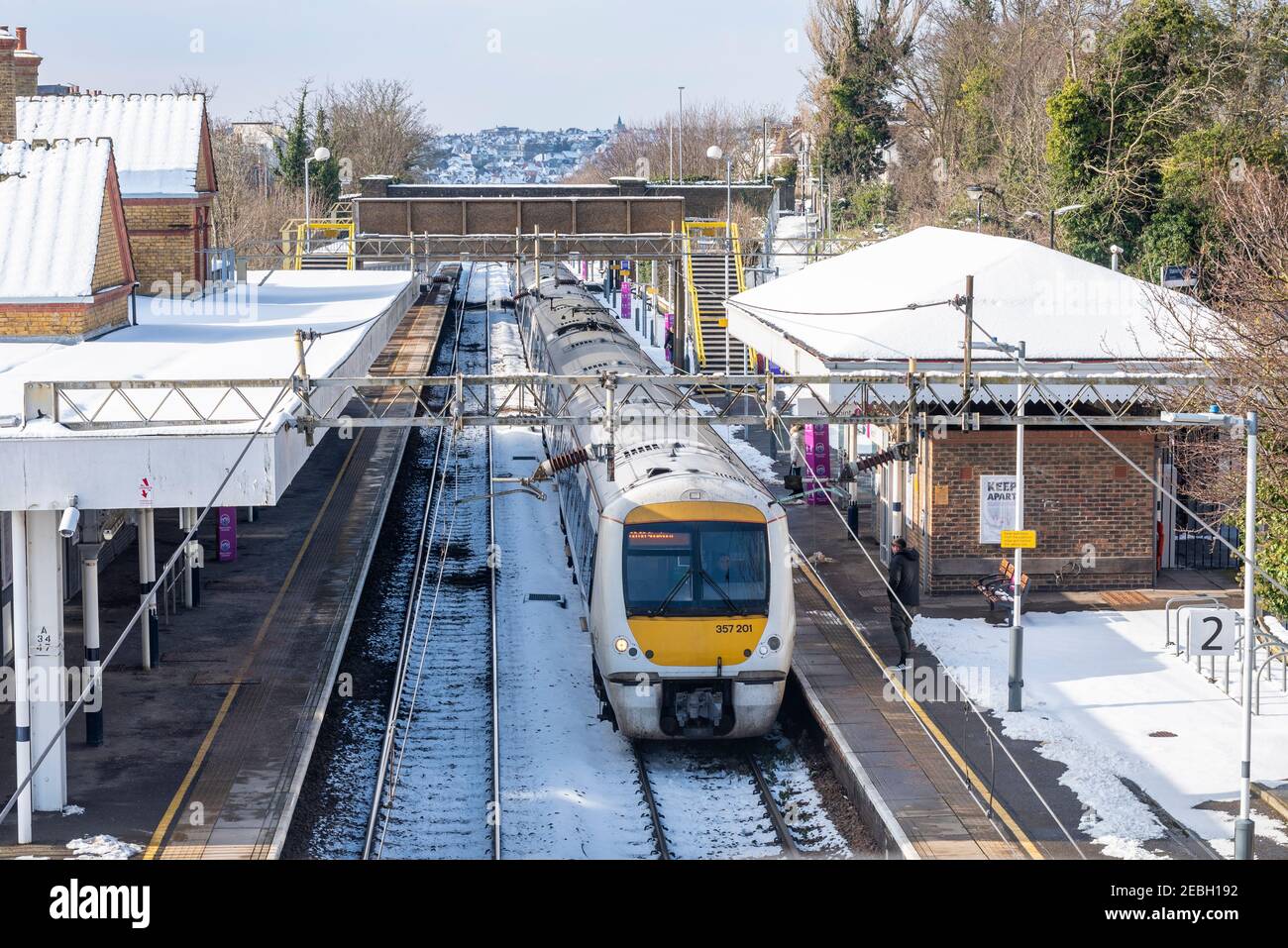 C2C train in Westcliff on Sea station, Southend Borough, Essex, UK, with snow from Storm Darcy. London Tilbury Southend line railway. Platform Stock Photo