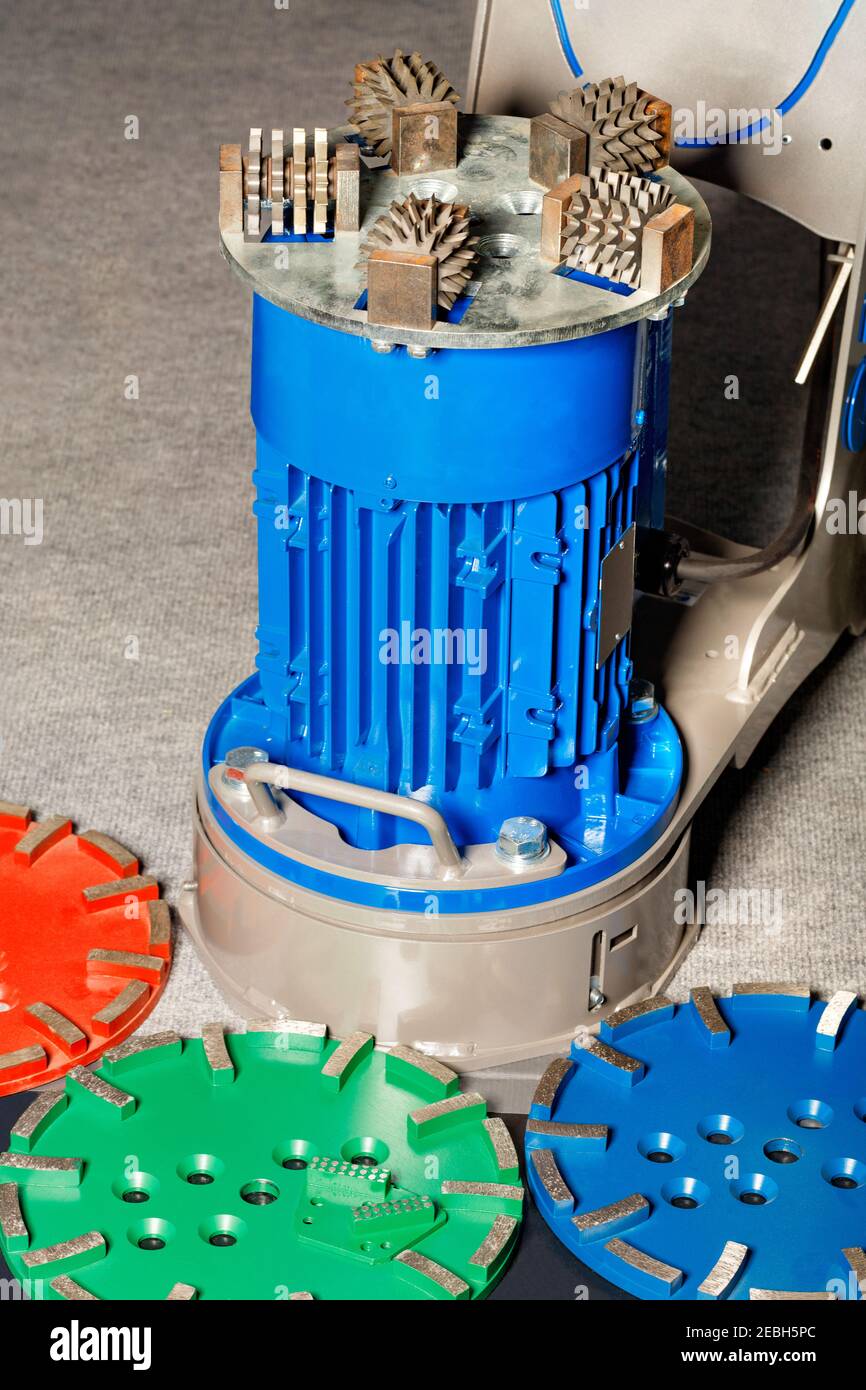 Single disc trowel grinder for convenient, fast processing of various floor surfaces in professional conditions. Stock Photo