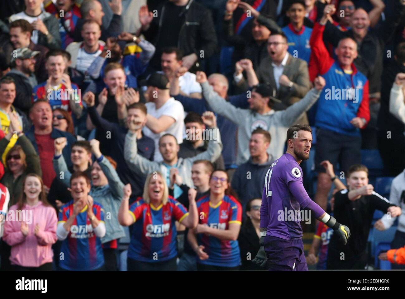 Soccer Football - Premier League - Crystal Palace v Huddersfield Town - Selhurst Park, London, Britain - March 30, 2019 Huddersfield Town's Ben Hamer reacts as Crystal Palace fans celebrate REUTERS/Hannah McKay EDITORIAL USE ONLY. No use with unauthorized audio, video, data, fixture lists, club/league logos or "live" services. Online in-match use limited to 75 images, no video emulation. No use in betting, games or single club/league/player publications. Please contact your account representative for further details. Stock Photo