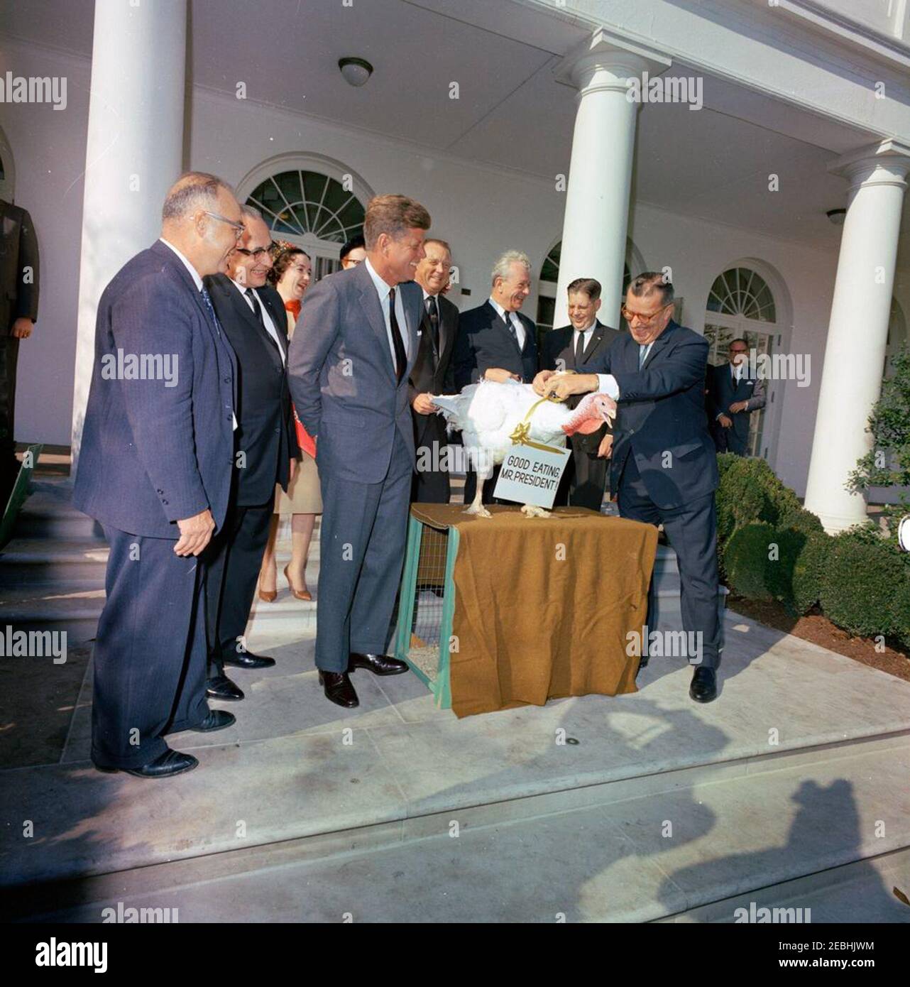 Presentation of a Thanksgiving Turkey to President Kennedy, 10:00AM. President John F. Kennedy laughs with officials at the presentation of a Thanksgiving turkey by the National Turkey Federation and the Poultry and Egg National Board; President Kennedy pardoned the turkey. Left to right: Vice President of the National Turkey Federation, Morris G. Smith; two unidentified persons; President Kennedy; President of the National Turkey Federation, Robert M. McPherrin; Senator Everett Dirksen (Illinois); Executive Secretary-Treasurer of the National Turkey Federation, M. C. Small. Also present: Pres Stock Photo