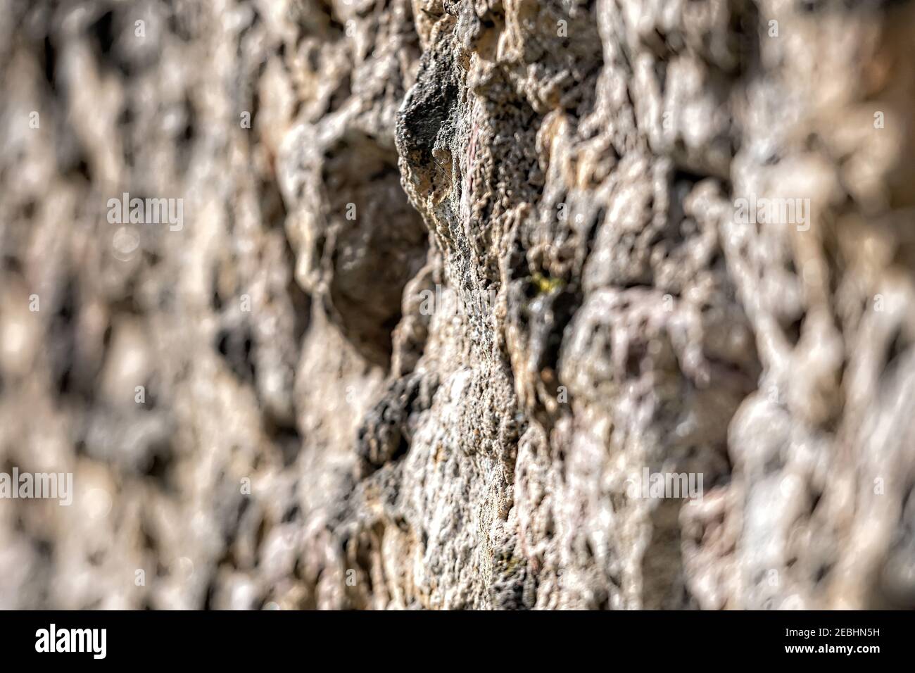 decorative exterior wall plaster with embossed surface, selective focus Stock Photo