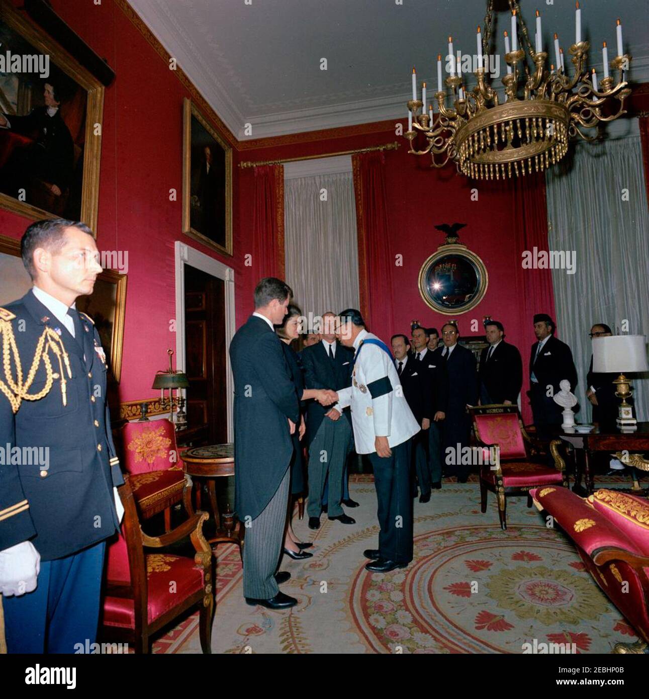 State Funeral of President Kennedy: White House, post funeral Reception. Jacqueline Kennedy and Senator Edward M. Kennedy (Massachusetts) greet guests during a reception at the White House, following the state funeral of President John F. Kennedy; Mrs. Kennedy shakes hands with an unidentified man. Also pictured: Minister of Foreign Relations of El Salvador, Dr. Hector Escobar Serrano; Minister of Foreign Affairs of Pakistan, Zulfikar Ali Bhutto; Ambassador of Pakistan, Ghulam Ahmed; U.S. Chief of Protocol, Angier Biddle Duke; Air Force Aide to President Kennedy, Brigadier General Godfrey T. M Stock Photo
