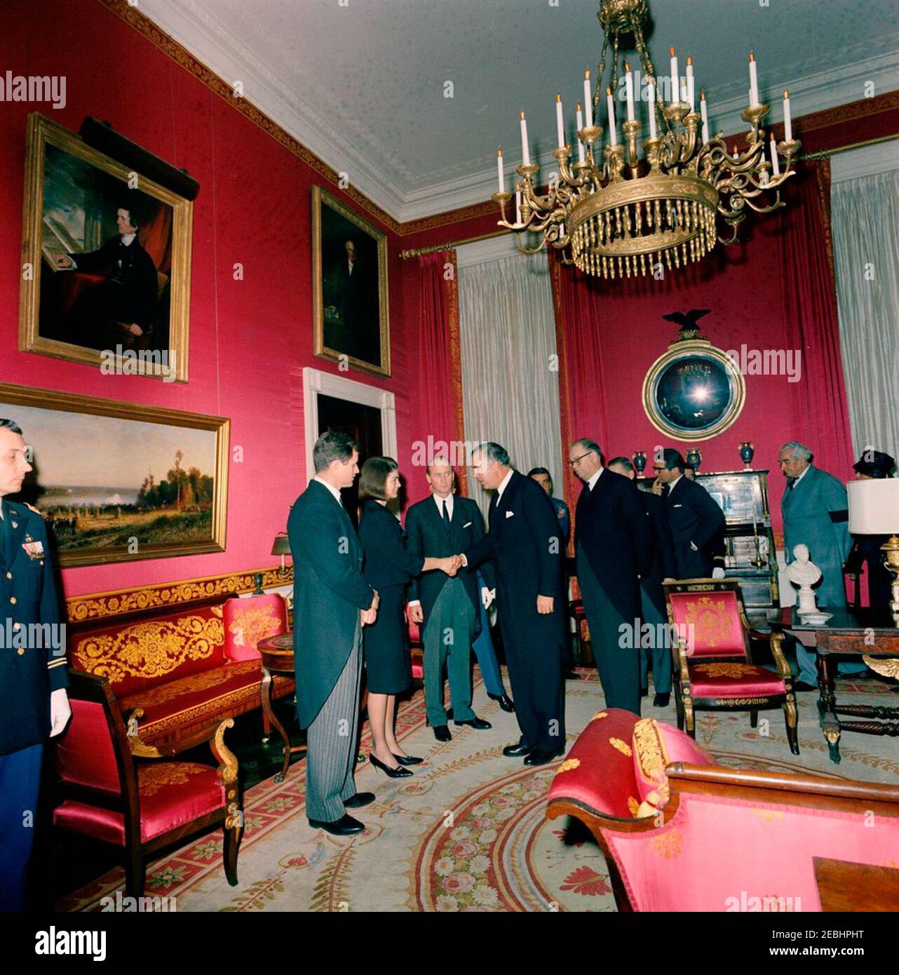 State Funeral of President Kennedy: White House, post funeral Reception. Jacqueline Kennedy and Senator Edward M. Kennedy (Massachusetts) greet guests during a reception at the White House, following the state funeral of President John F. Kennedy; Mrs. Kennedy shakes hands with Prince Bertil of Sweden. Also pictured: Prime Minister of Sweden, Tage Erlander; Prime Minister of Jamaica, Sir Alexander Bustamante; First Lady of Jamaica, Gladys Bustamante (mostly hidden); U.S. Chief of Protocol, Angier Biddle Duke; Air Force Aide to President Kennedy, Brigadier General Godfrey T. McHugh (partially h Stock Photo