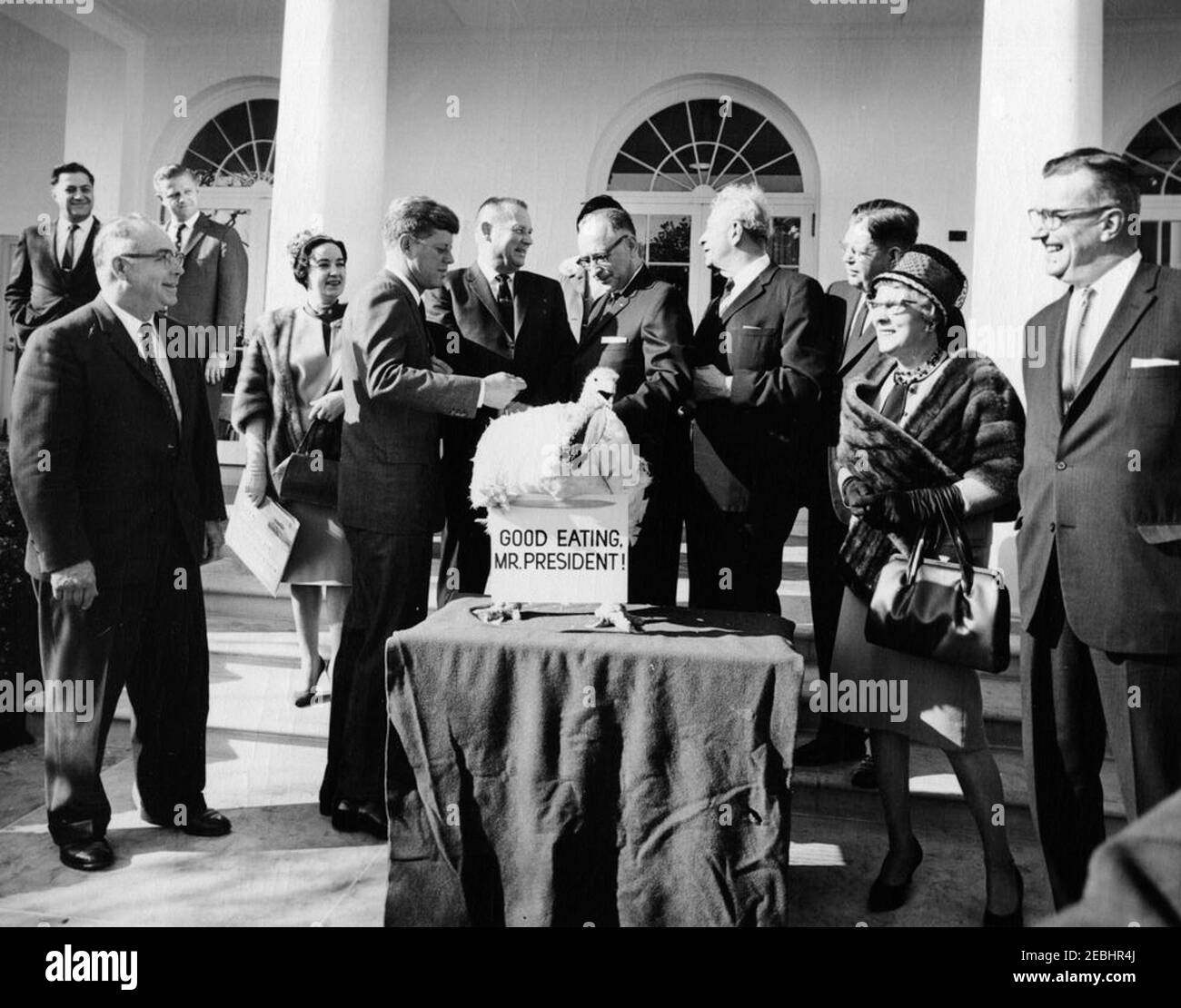 Presentation of a Thanksgiving Turkey to President Kennedy, 10:00AM. President John F. Kennedy Kennedy receives a turkey presented to him for Thanksgiving by the National Turkey Federation and the Poultry and Egg National Board; President Kennedy pardoned the turkey. Left to right: Administrative Assistant to the President, Mike Manatos; Vice President of the National Turkey Federation, Morris G. Smith; two unidentified persons; President Kennedy; President of the National Turkey Federation, Robert M. McPherrin; unidentified; Senator Everett Dirksen (Illinois); Executive Secretary-Treasurer of Stock Photo