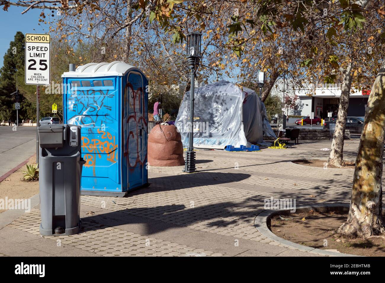 Los Angeles, CA USA - January 9, 2021: A portable bathroom or outhouse and hand washing station put out for the homeless Stock Photo
