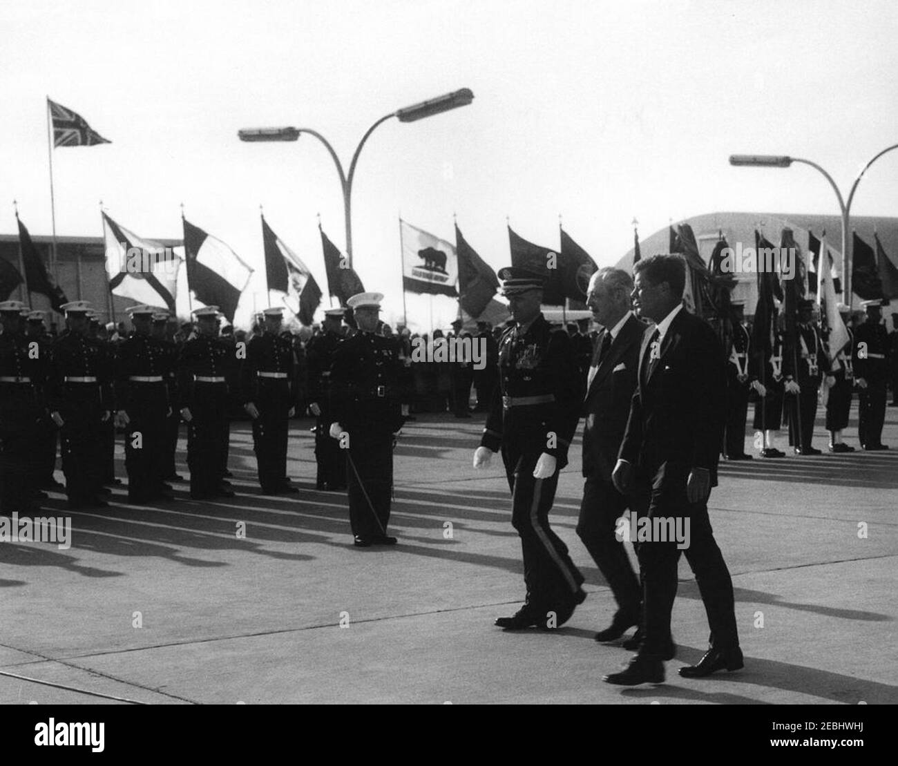 Arrival ceremonies for Harold Macmillan, Prime Minister of Great Britain, 4:50PM. Commander of Troops, Lieutenant Colonel Charles P. Murray, Jr. (center right), escorts President John F. Kennedy and Prime Minister of Great Britain, Harold Macmillan, past the United States Marine Corps Honor Guard during arrival ceremonies for Prime Minister Macmillan. Andrews Air Force Base, Maryland. Stock Photo