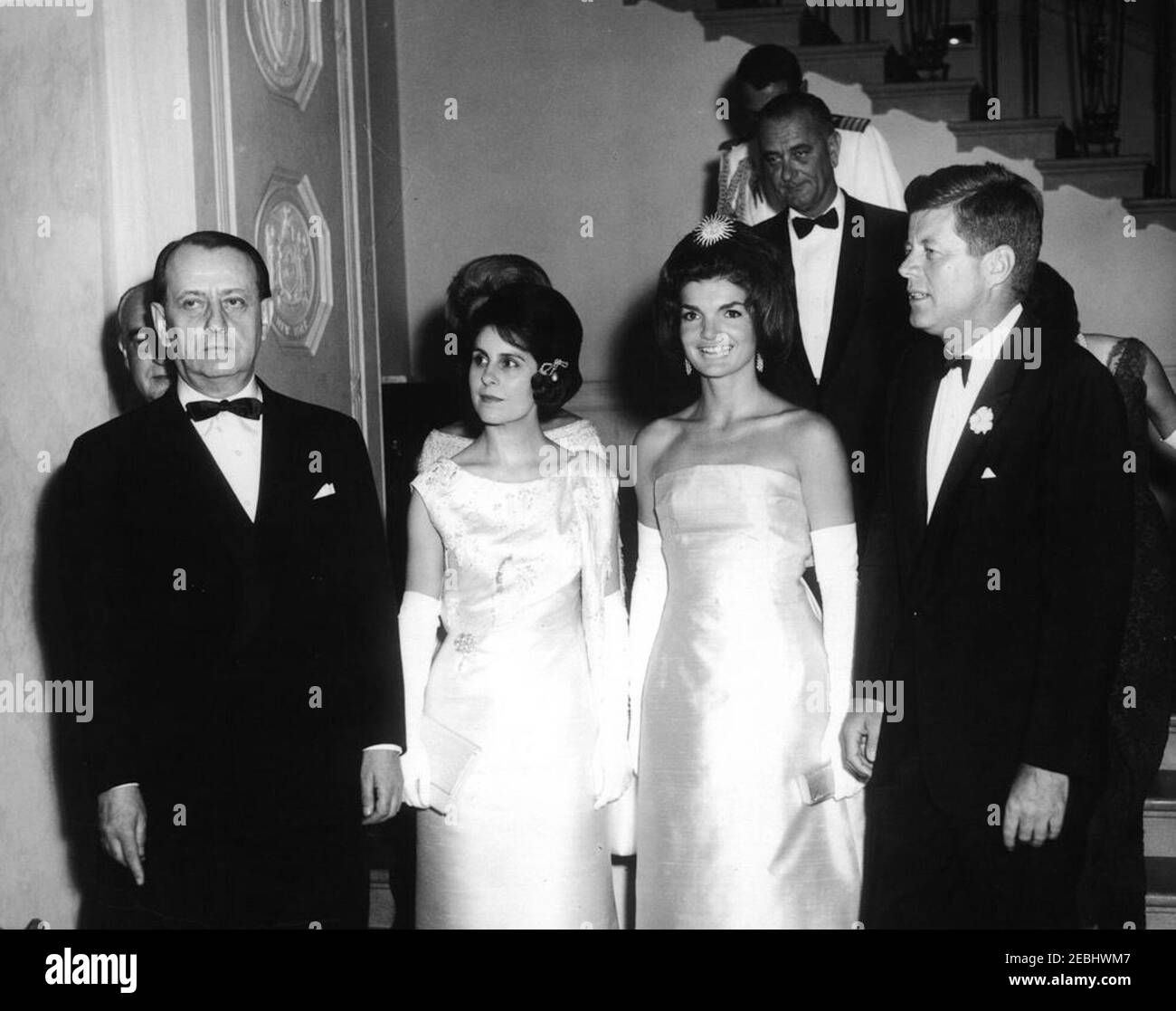 Dinner in honor of Andru00e9 Malraux, Minister of State for Cultural Affairs of France, 8:00PM. President John F. Kennedy and others arrive at a dinner in honor of Minister of State for Cultural Affairs of France, Andru00e9 Malraux. Front row (L-R): Minister Malraux; wife of the minister, pianist Madeleine Malraux; First Lady Jacqueline Kennedy; President Kennedy. Back rows (L-R): French Ambassador to the United States, Hervu00e9 Alphand (behind Minister Malraux); wife of the ambassador, Nicole Alphand (mostly hidden); Vice President Lyndon B. Johnson; Naval Aide to the President, Captain T Stock Photo