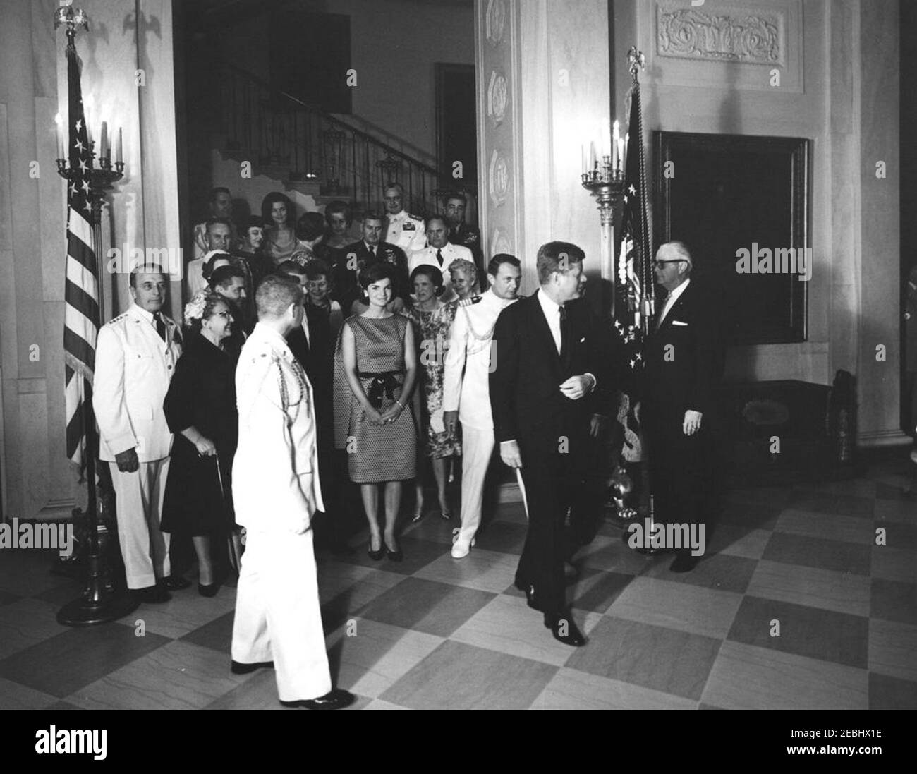 Military Reception at the White House, 6:00PM. President John F. Kennedy and others attend a military reception at the White House. Those pictured include: First Lady Jacqueline Kennedy; Chairman of the Joint Chiefs of Staff, General Lyman L. Lemnitzer, and his wife, Katherine Lemnitzer; Secretary of the Army, Elvis J. Stahr, Jr., and his wife, Dorothy Stahr; Secretary of Defense, Robert S. McNamara; Secretary of the Navy, Fred Korth, and his wife, Vera Korth; General Maxwell D. Taylor and his wife, Lydia Taylor; Military Aide to the President, General Chester V. Clifton, and his wife, Anne Bo Stock Photo