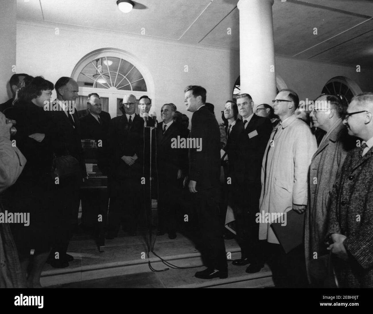 Visit of scientists who took part in the original Fermi Experiment, 1942, 5:30PM. President John F. Kennedy visits with a group of scientists involved in the original Enrico Fermi experiment, conducted as part of the Manhattan Project in 1942, during a visit marking the 20th anniversary of the experiment. Left to right: professor of atomic and nuclear physics at New York University, Dr. Leona Woods Marshall; Director of Nuclear Weapons Testing for the Atomic Energy Commission (AEC), Dr. Alvin C. Graves; unidentified; former Director of Argonne National Laboratory, Dr. Walter H. Zinn; unidentif Stock Photo