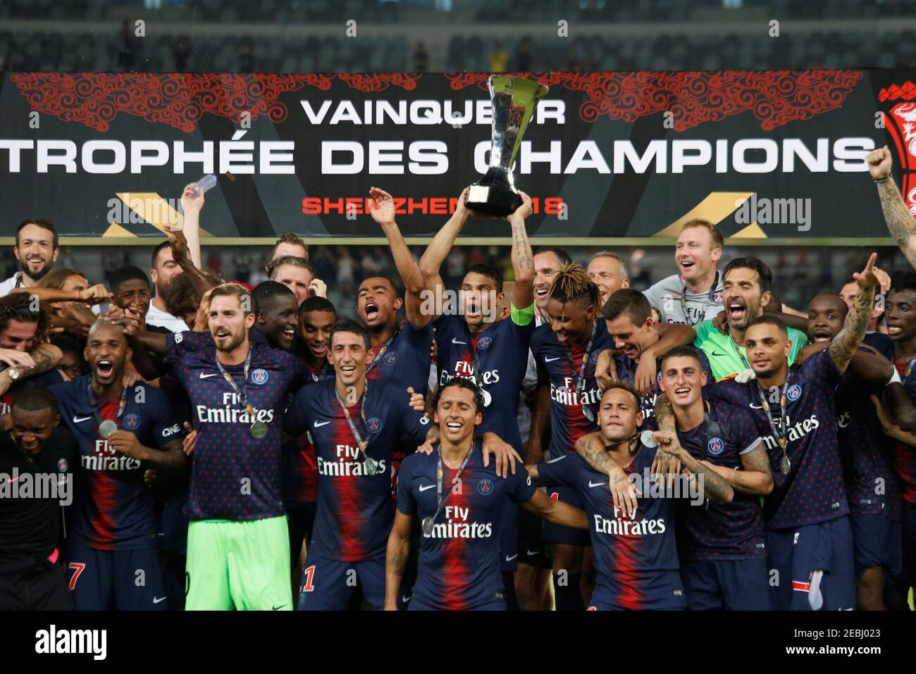Soccer Football - French Super Cup Trophee des Champions - Paris St Germain v AS Monaco - Shenzhen Universiade Sports Centre, Shenzhen, China - August 4, 2018   Paris St Germain's Thiago Silva celebrates with the trophy and team mates after winning the French Super Cup   REUTERS/Bobby Yip Stock Photo
