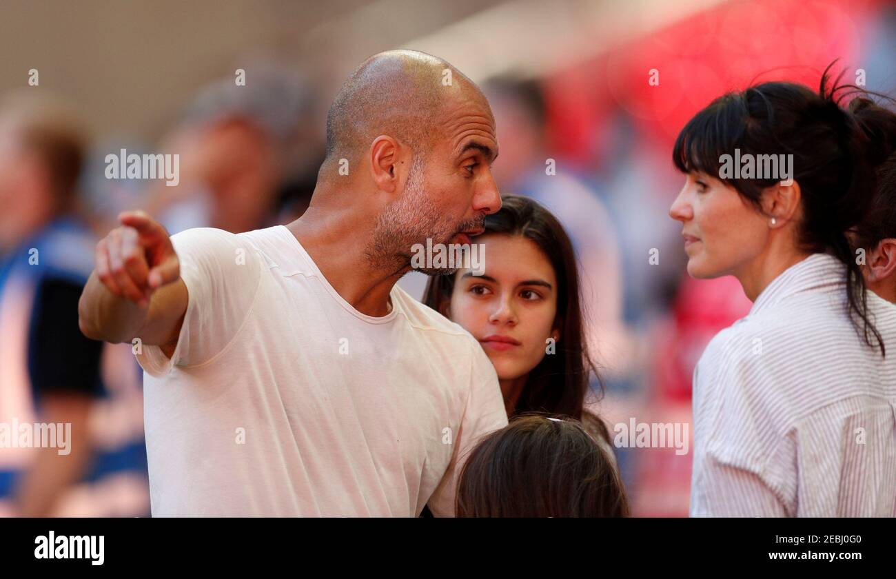 Soccer Football - FA Community Shield - Manchester City v Chelsea - Wembley Stadium, London, Britain - August 5, 2018  Manchester City manager Pep Guardiola celebrates winning the community shield with his wife Cristina Serra and family after the match  Action Images via Reuters/John Sibley Stock Photo
