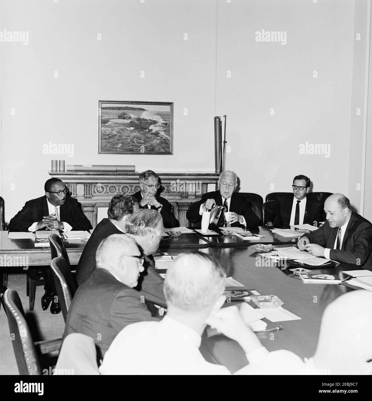 Meeting of the Presidentu0027s Commission on Equal Opportunity in Housing, Executive Office Building (EOB). Members of the Presidentu2019s Committee on Equal Opportunity in Housing meet in the Executive Office Building. Those pictured include: Chairman of the Presidentu2019s Committee on Equal Opportunity in Housing, David L. Lawrence (seated third from right); and Administrator of the Housing and Home Finance Agency (HHFA), Robert C. Weaver (seated far right). Washington D.C. Stock Photo