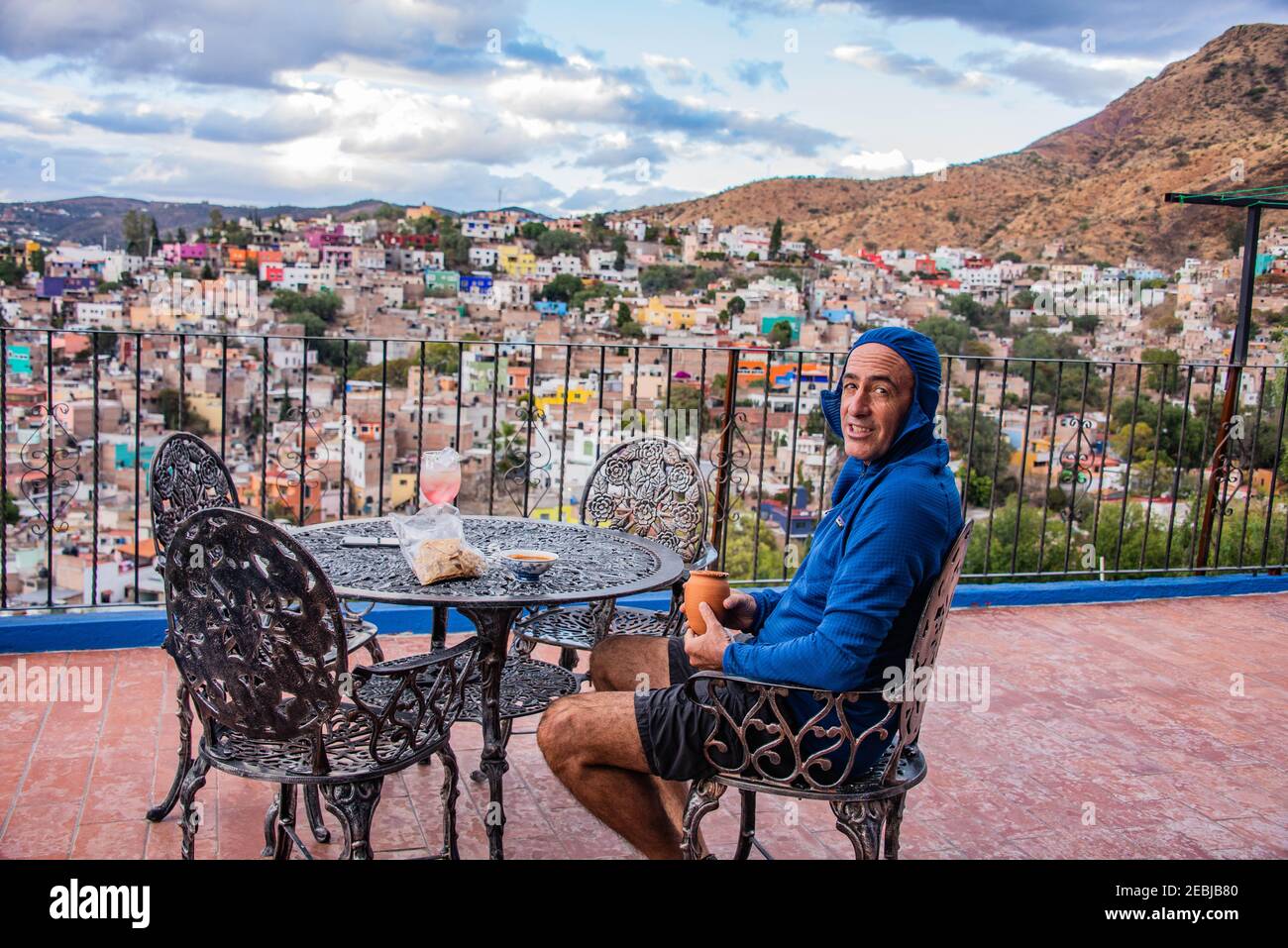 Drinking a glass of margarita with the view of the UNESCO World Heritage Centro Historico in Guanajuato, Mexico Stock Photo