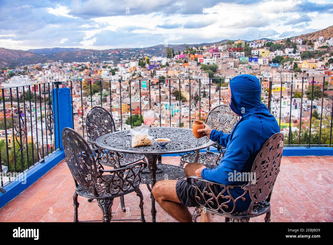 Drinking a glass of margarita with the view of the UNESCO World Heritage Centro Historico in Guanajuato, Mexico Stock Photo