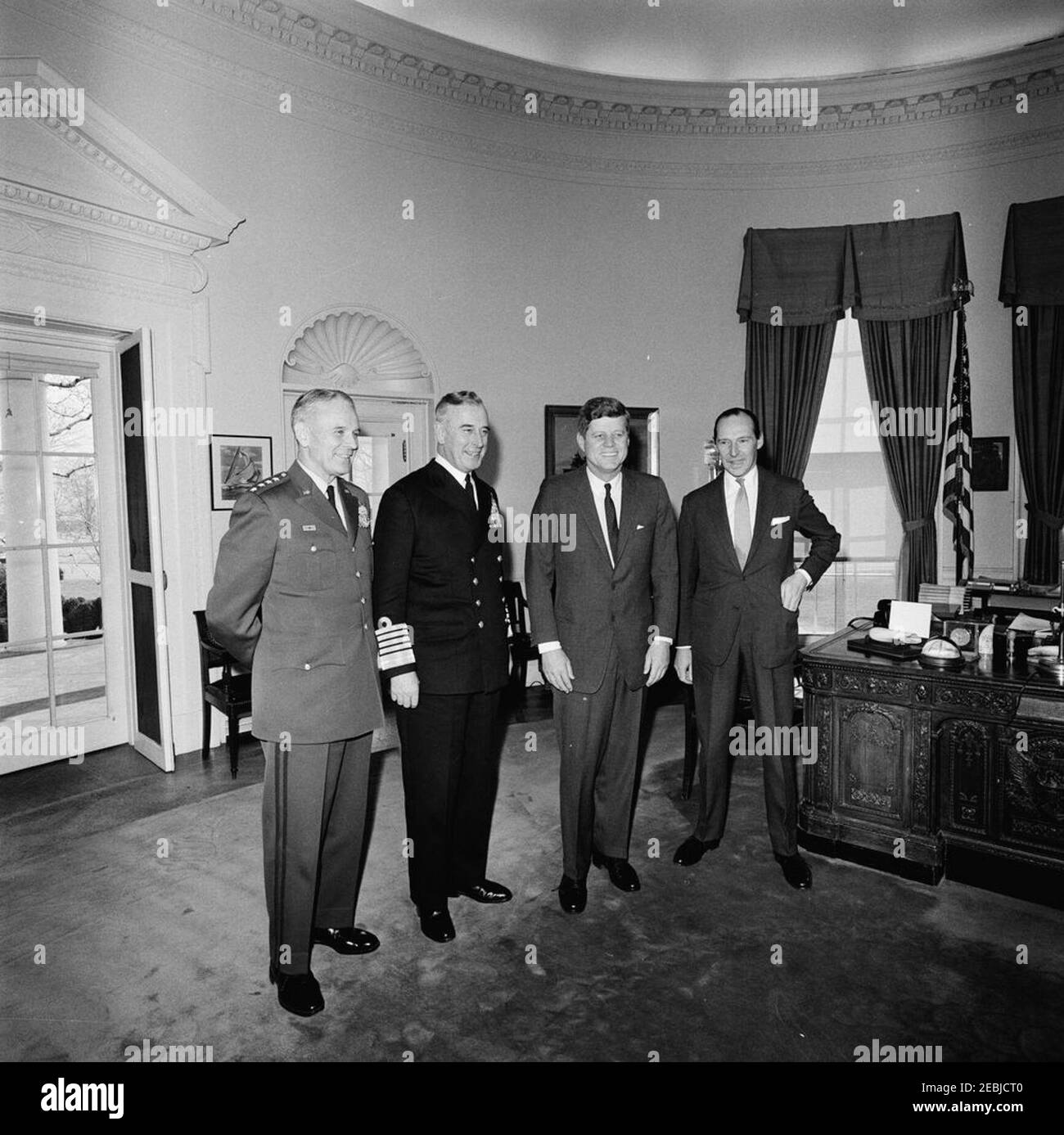 Meeting with The Earl Mountbatten, Chief of the British Defense Staff, 12:05PM. President John F. Kennedy meets with Chief of the Defense Staff of the British Armed Forces and Admiral of the Fleet, Lord Louis Mountbatten, First Earl Mountbatten of Burma. Left to right: Chairman of the Joint Chiefs of Staff, General Maxwell D. Taylor; Lord Mountbatten; President Kennedy; Ambassador of Great Britain, Sir David Ormsby-Gore. Oval Office, White House, Washington, D.C. Stock Photo