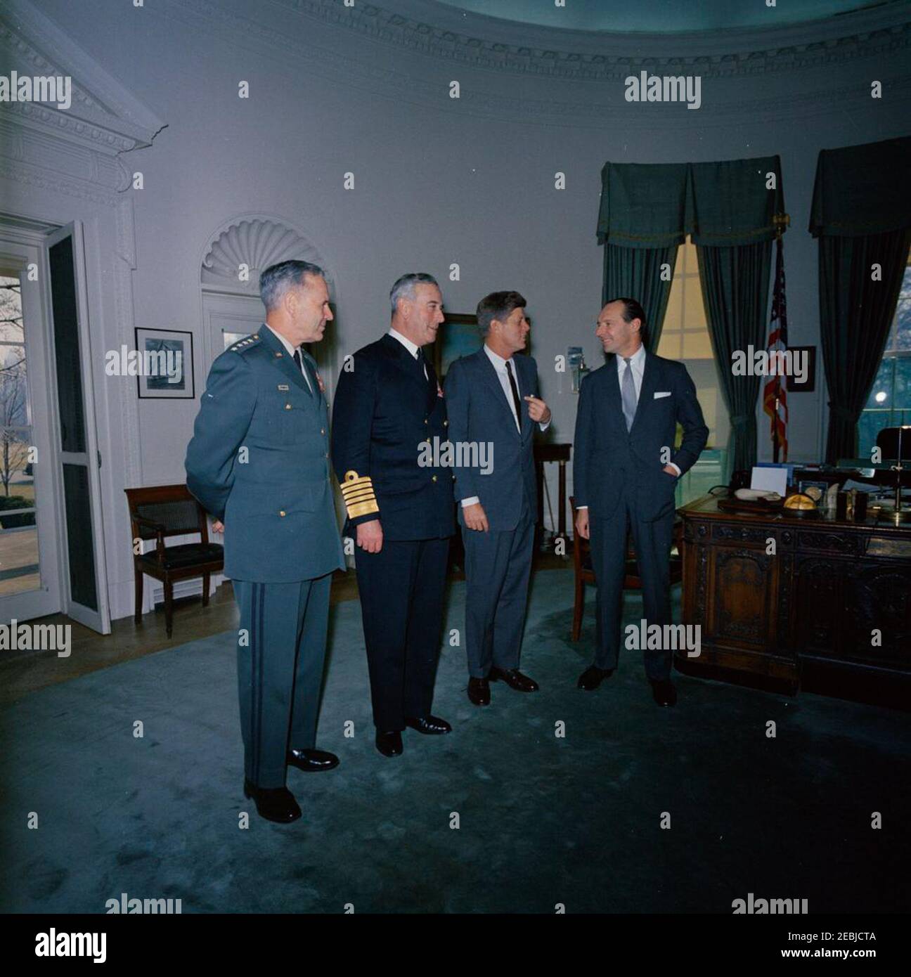 Meeting with The Earl Mountbatten, Chief of the British Defense Staff, 12:05PM. President John F. Kennedy meets with Chief of the Defense Staff of the British Armed Forces and Admiral of the Fleet, Lord Louis Mountbatten, First Earl Mountbatten of Burma. Left to right: Chairman of the Joint Chiefs of Staff, General Maxwell D. Taylor; Lord Mountbatten; President Kennedy; Ambassador of Great Britain, Sir David Ormsby-Gore. Oval Office, White House, Washington, D.C. Stock Photo