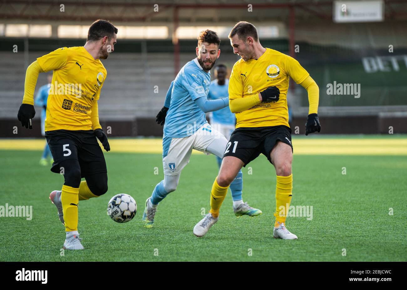 Malmoe, Sweden. 12th Feb, 2021. Erdal Rakip (19) of Malmoe FF seen in between Kadir Hodzic (5) and Adam Petersson (21) of Mjallby during a test match between Malmoe FF and Mjallby AIF at Malmoe Idrottsplats in Malmoe. (Photo Credit: Gonzales Photo/Alamy Live News Stock Photo
