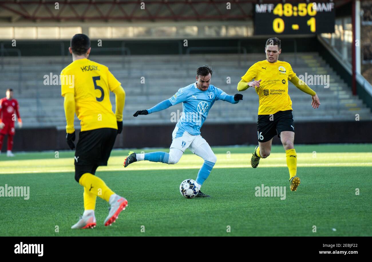 Malmoe, Sweden. 12th Feb, 2021. Eric Larsson (2) of Malmoe FF and Jacob Bergstrom (16) of Mjallby seen during a test match between Malmoe FF and Mjallby AIF at Malmoe Idrottsplats in Malmoe. (Photo Credit: Gonzales Photo/Alamy Live News Stock Photo