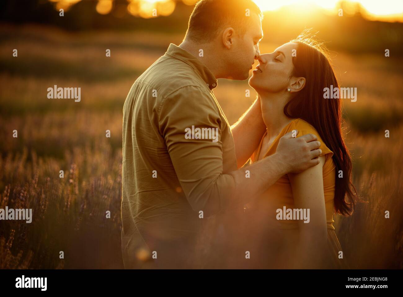 Romantic pregnant couple enjoying in field in summer day.Love ...