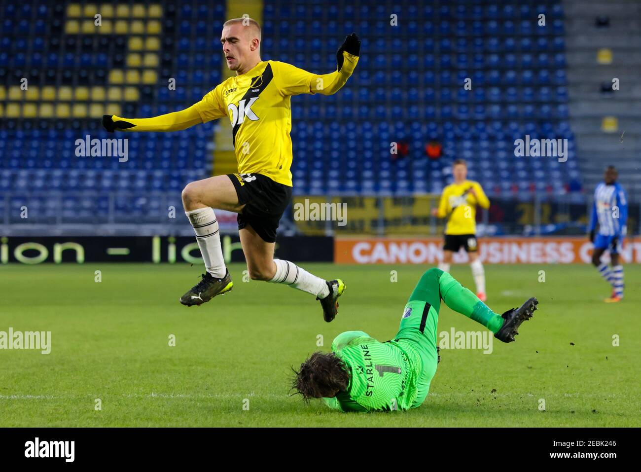 BREDA, NETHERLANDS - FEBRUARY 12: Lewis Fiorini of NAC Breda, goalkeeper Ruud Swinkels of FC Eindhoven during the Keukenkampioendivisie match between Stock Photo