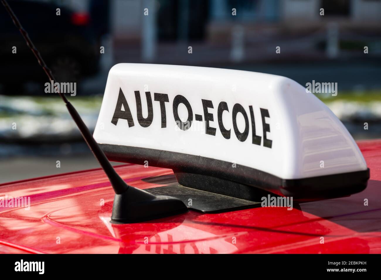 Sign fixed on the roof of a learning car indicating 'Auto-école' written in French, meaning 'Driving school'. France Stock Photo