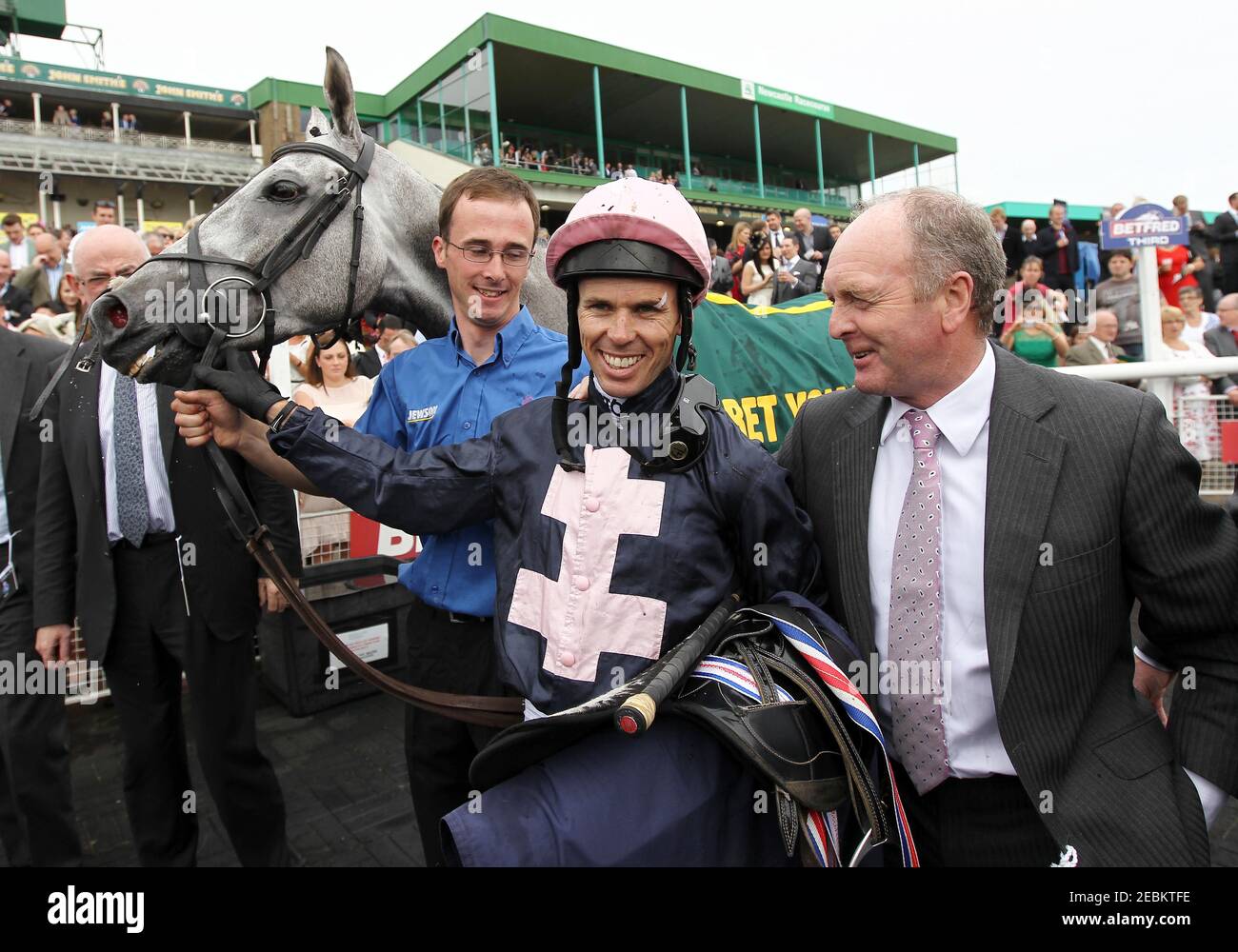 Horse Racing - Northumberland Plate - Newcastle Racecourse - 29/6/13  Trainer Jonjo O'Neill (R) and jockey Graham Lee after winning the 15.15 The John Smiths Northumberland Plate with Tominator  Mandatory Credit: Action Images / Ed Sykes  Livepic Stock Photo