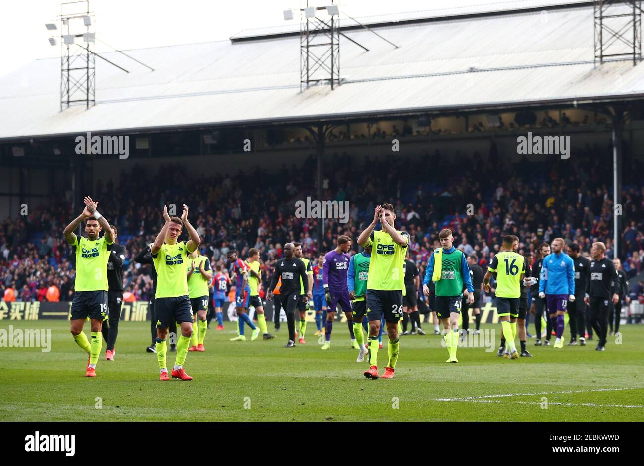 Soccer Football - Premier League - Crystal Palace v Huddersfield Town - Selhurst Park, London, Britain - March 30, 2019 Huddersfield Town players applaud fans after the match as they are relegated from the Premier League REUTERS/Hannah McKay EDITORIAL USE ONLY. No use with unauthorized audio, video, data, fixture lists, club/league logos or "live" services. Online in-match use limited to 75 images, no video emulation. No use in betting, games or single club/league/player publications. Please contact your account representative for further details. Stock Photo