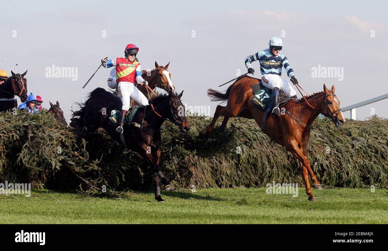 Horse Racing - Aintree Grand National Meeting - Aintree Racecourse - 2/4/09  Trust Fund ridden by Tom Greenall (R) wins the 3.45 John Smith's Fox Hunter's Steeple Chase  Mandatory Credit: Action Images / Scott Heavey  Livepic Stock Photo