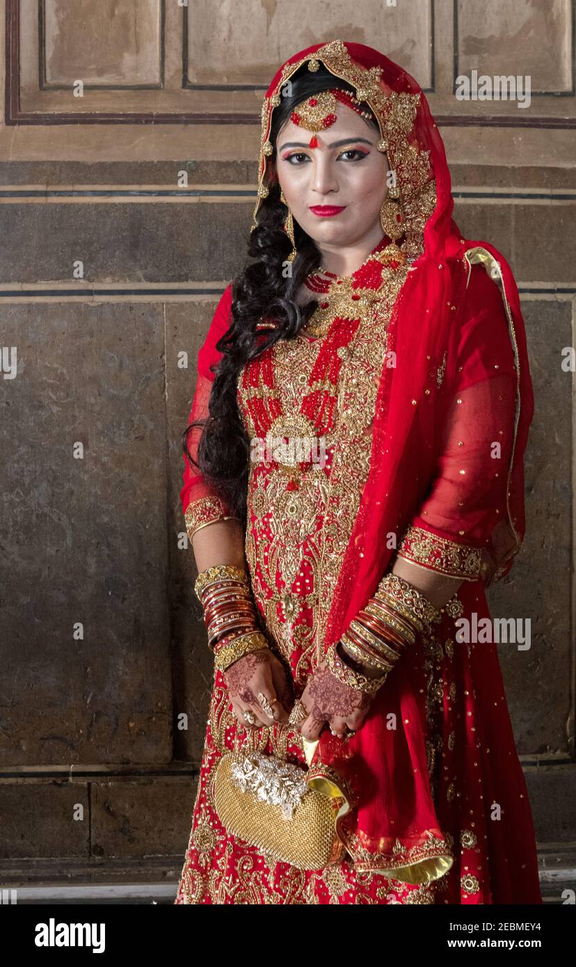 Bride's relative wearing traditional dress posing at Badshahi Mosque, Lahore, Punjab, Pakistan Stock Photo