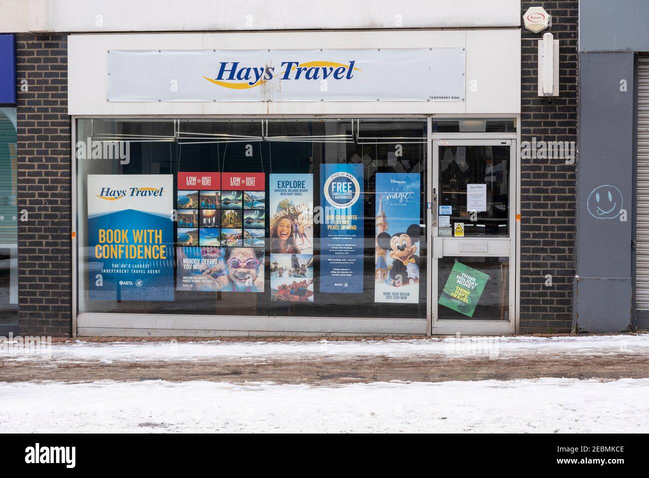 Hays Travel shop in High Street in Southend on Sea, Essex, UK, with snow on the ground from Storm Darcy, during COVID 19 lockdown. Grim. Stock Photo