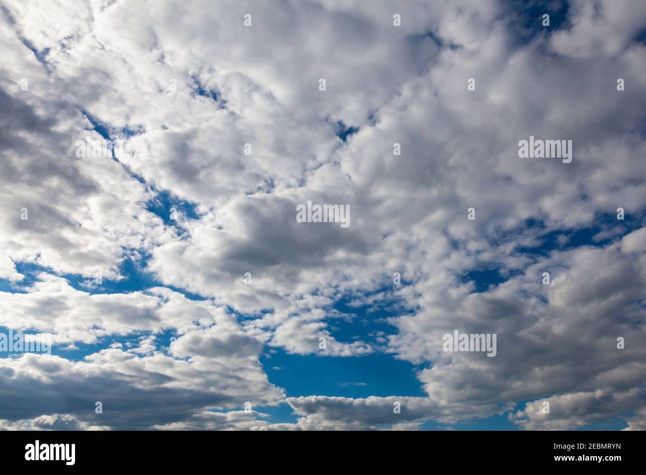 Scenic white clouds float across the blue sky Stock Photo