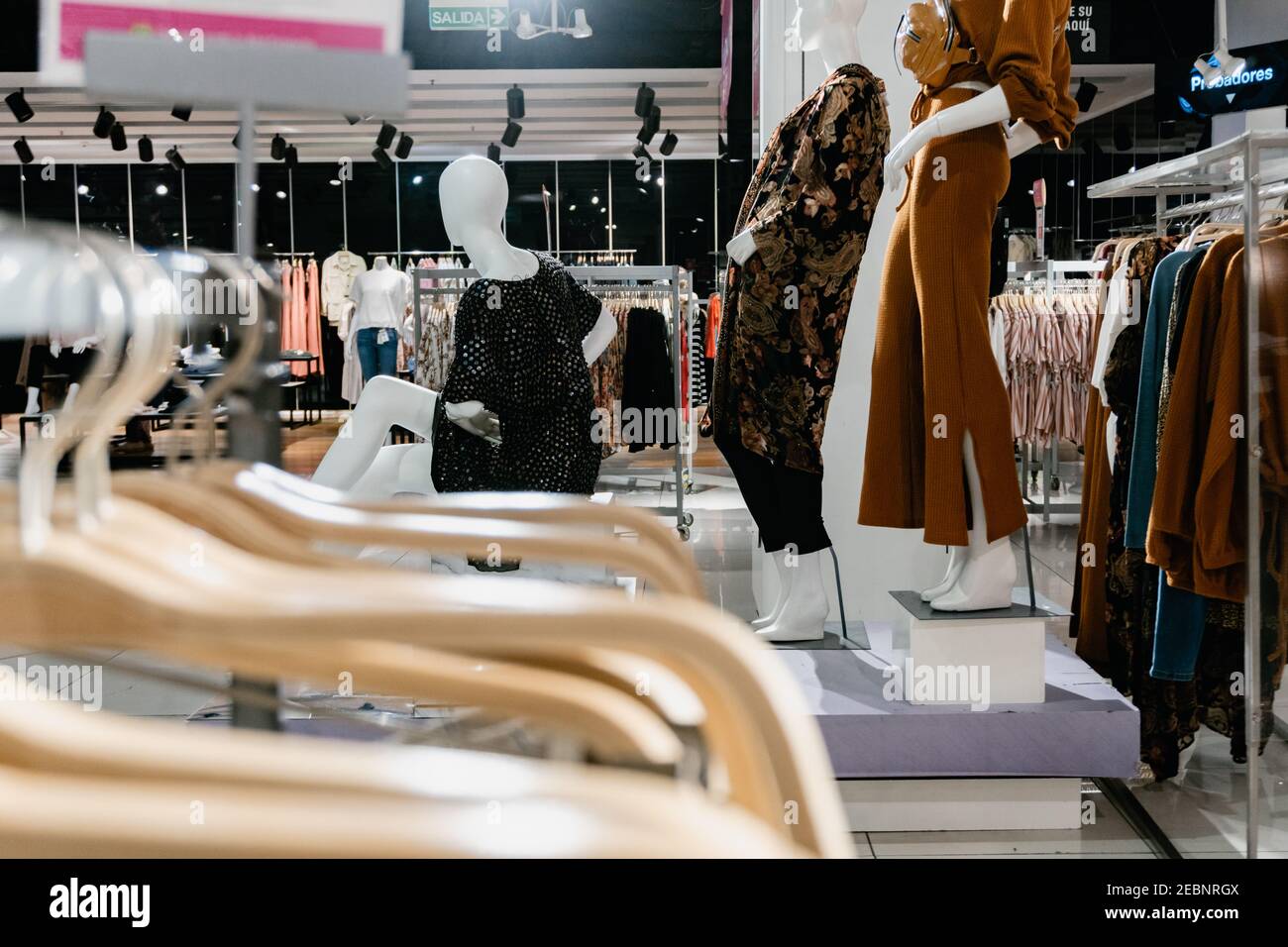 clothing store with 3 mannequins in the background, women's section. Falabella Argentina Stock Photo