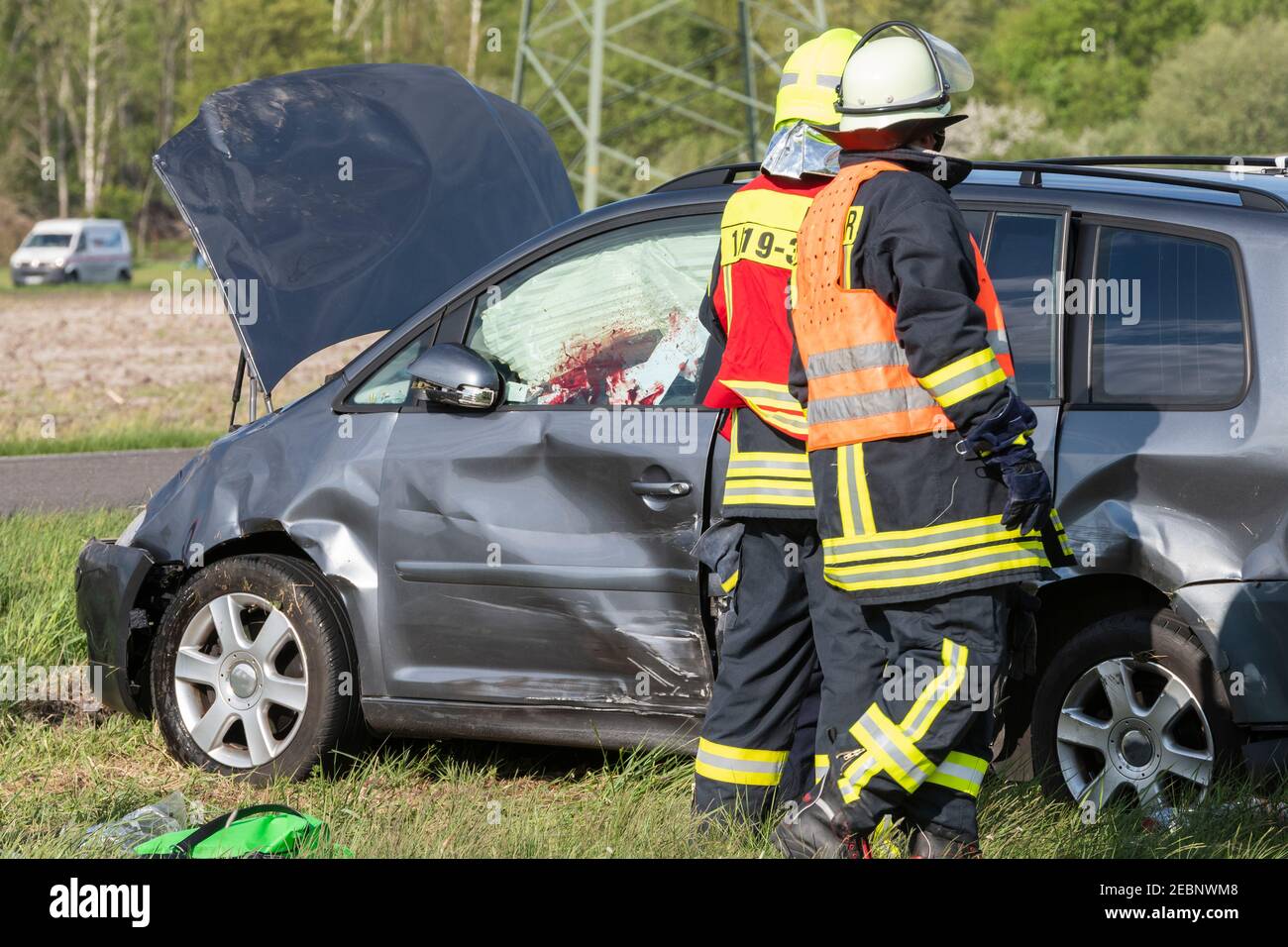 Firefighters at the scene of the accident Stock Photo