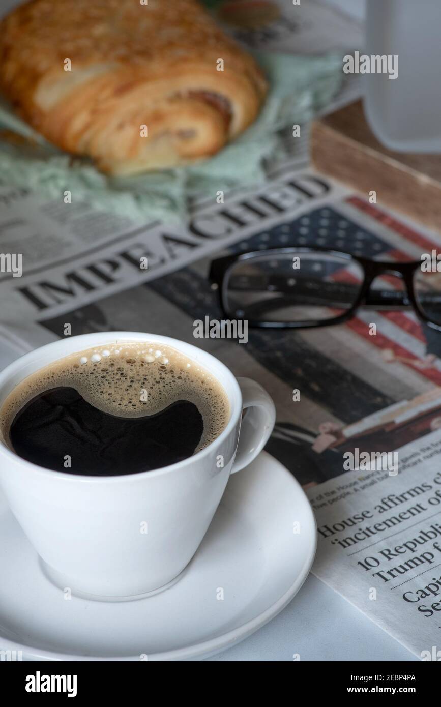 Good Morning America, Donald Trump was impeached again, still life with Sacramento Bee newspaper, coffee and croissant Stock Photo