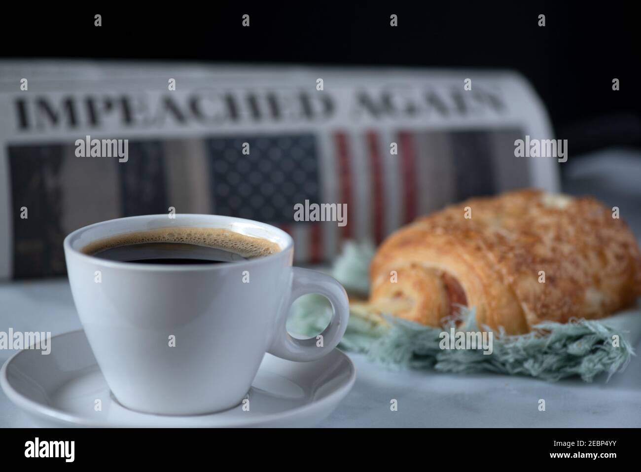 Good Morning America, Donald Trump was impeached again, still life with Sacramento Bee newspaper, coffee and croissant Stock Photo