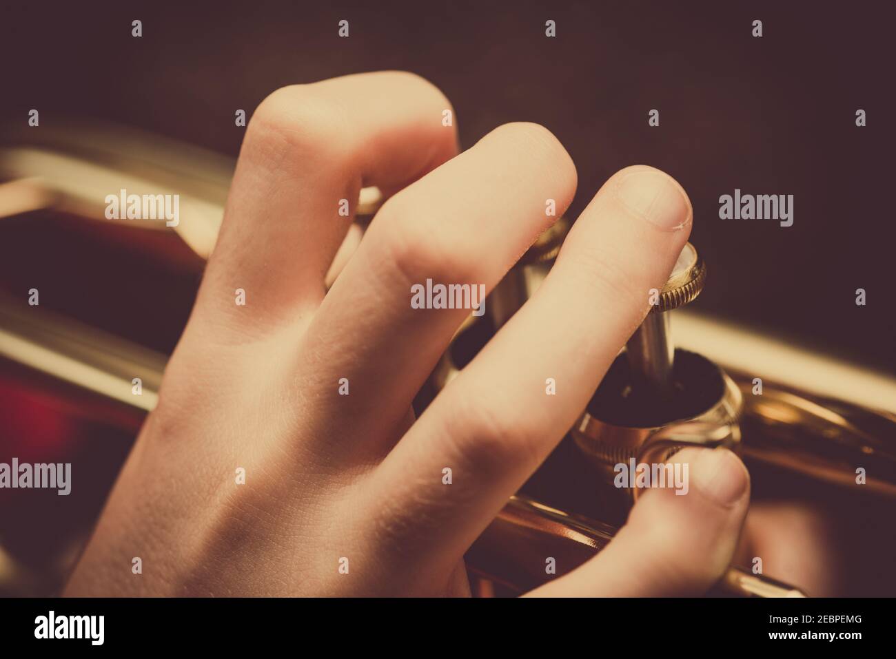 Close up of a child playing a trumpet Stock Photo