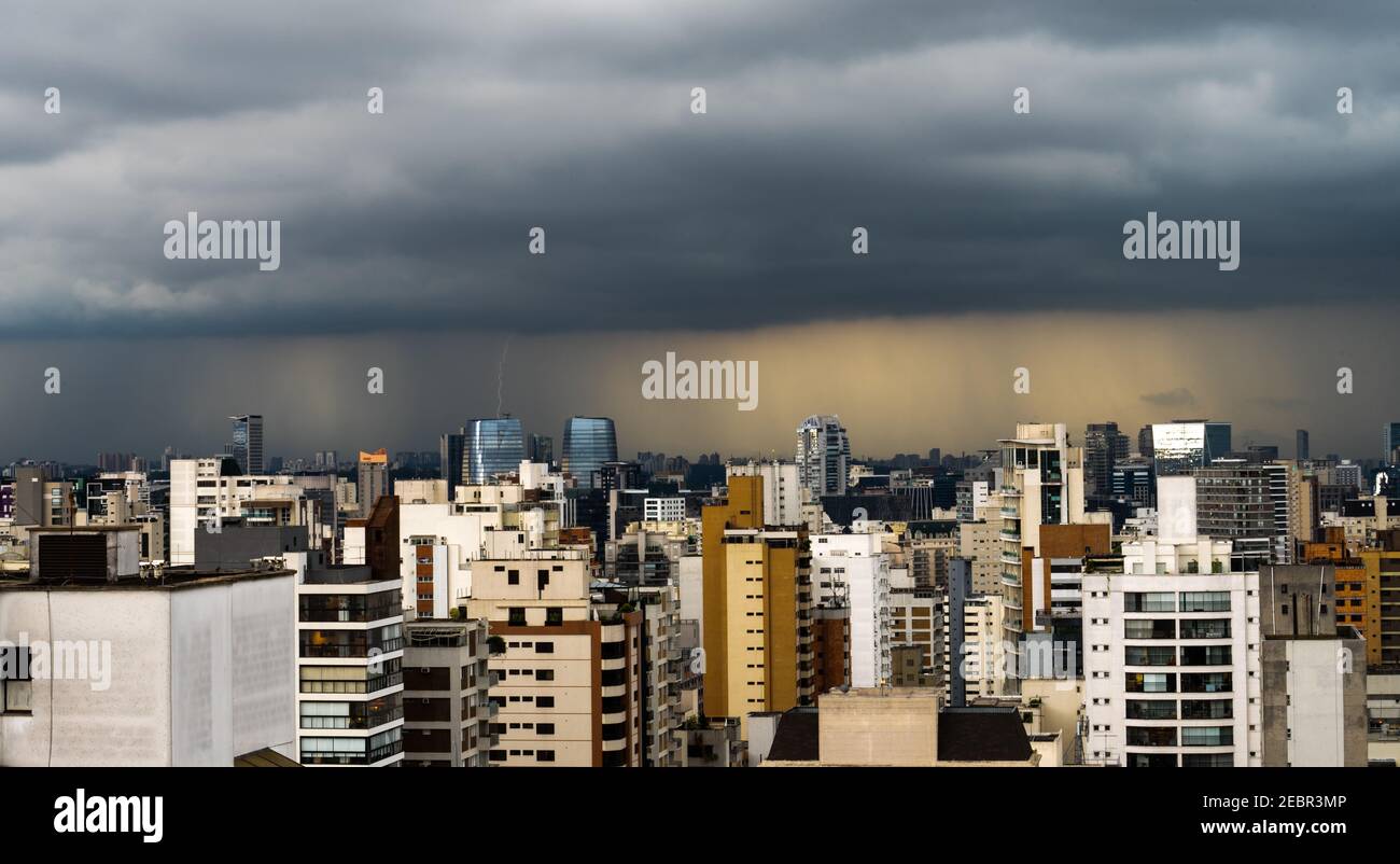 City Skyline of an afternoon lightning storm with multiple lightning bolts over the Vila Olimpia and Chacara Itaim neighboor in Sao Paulo, Brazil Stock Photo