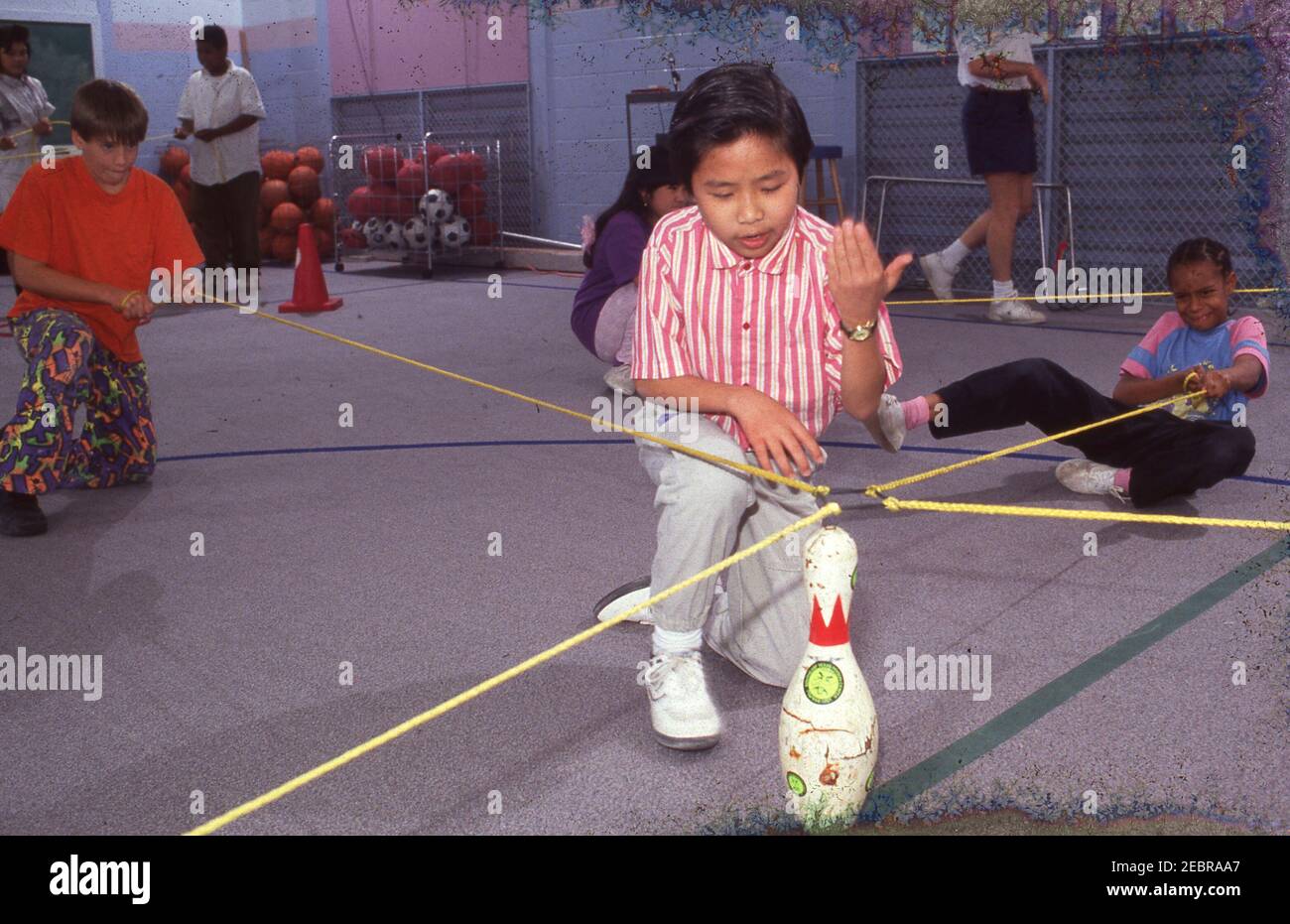 Physical Education: Cooperative learning situations for 4h graders, Walnut Creek Elementary School, Austin, Texas. ©Bob Daemmrich Stock Photo