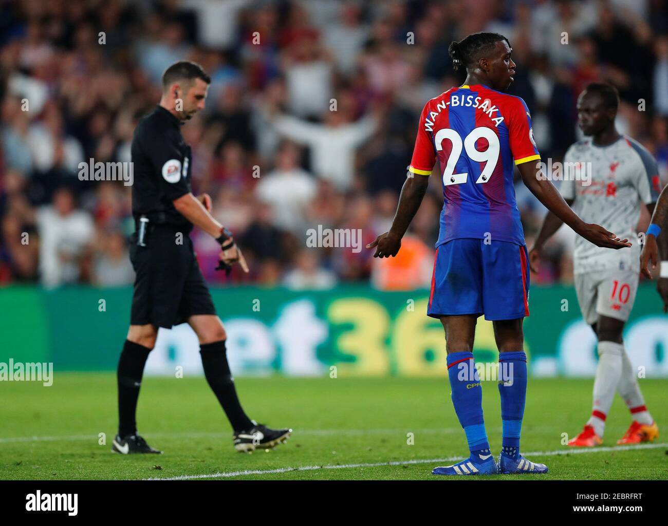 Soccer Football - Premier League - Crystal Palace v Liverpool - Selhurst Park, London, Britain - August 20, 2018  Crystal Palace's Aaron Wan-Bissaka concedes a foul against Liverpool's Mohamed Salah (not pictured) and is subsequently shown a red card by the referee                      REUTERS/Eddie Keogh  EDITORIAL USE ONLY. No use with unauthorized audio, video, data, fixture lists, club/league logos or "live" services. Online in-match use limited to 75 images, no video emulation. No use in betting, games or single club/league/player publications.  Please contact your account representative  Stock Photo