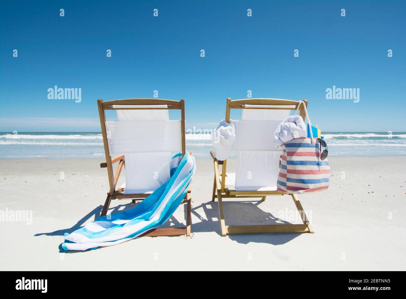 Canvas chairs on beach Stock Photo