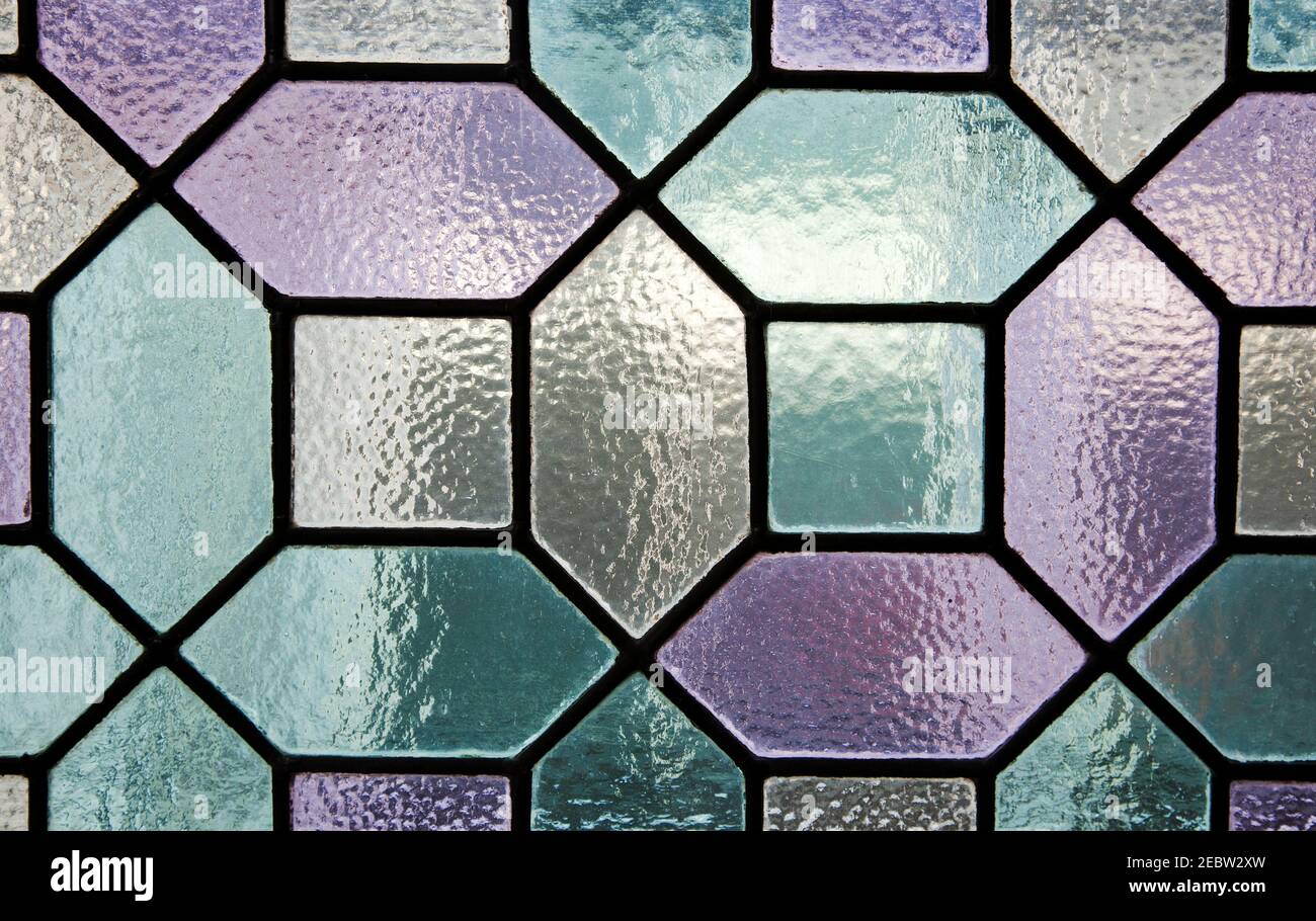 stained glass in a pattern of purple and green Stock Photo