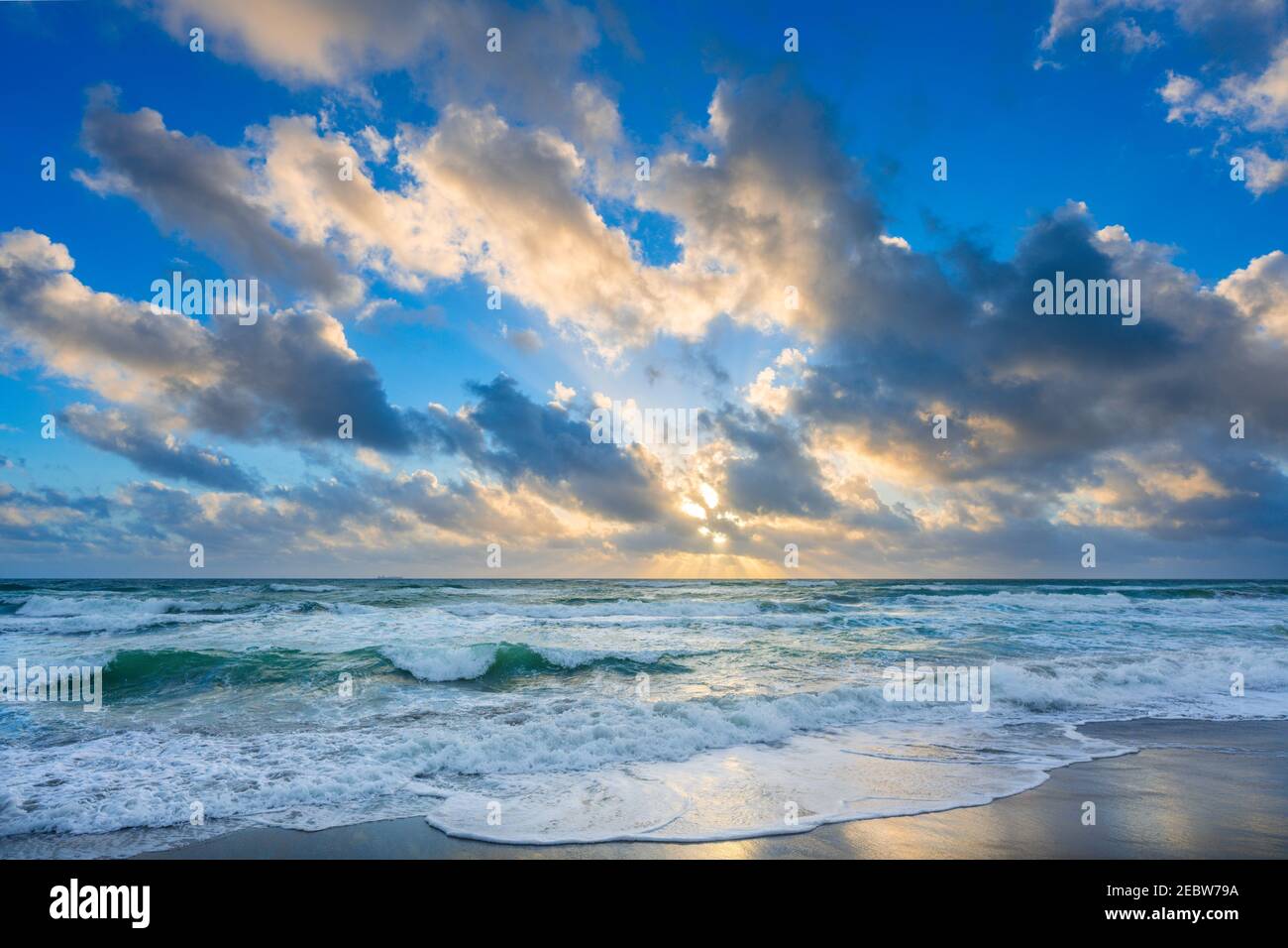 Clouds over sea at sunset Stock Photo