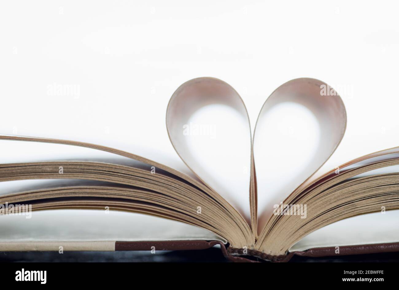 Book with pages folded in heart shape Stock Photo