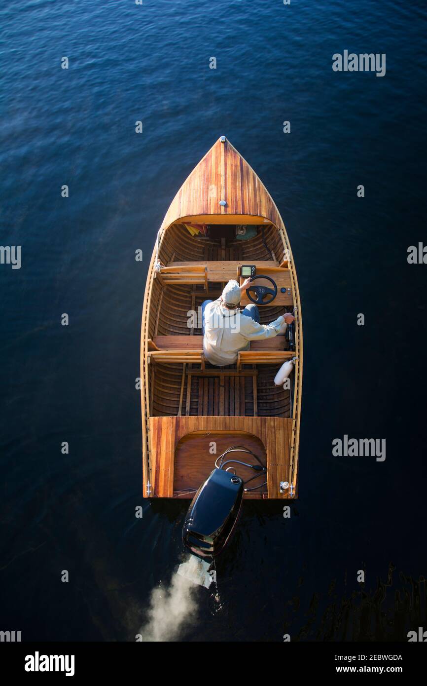 Man in motorboat on Lake Placid Stock Photo