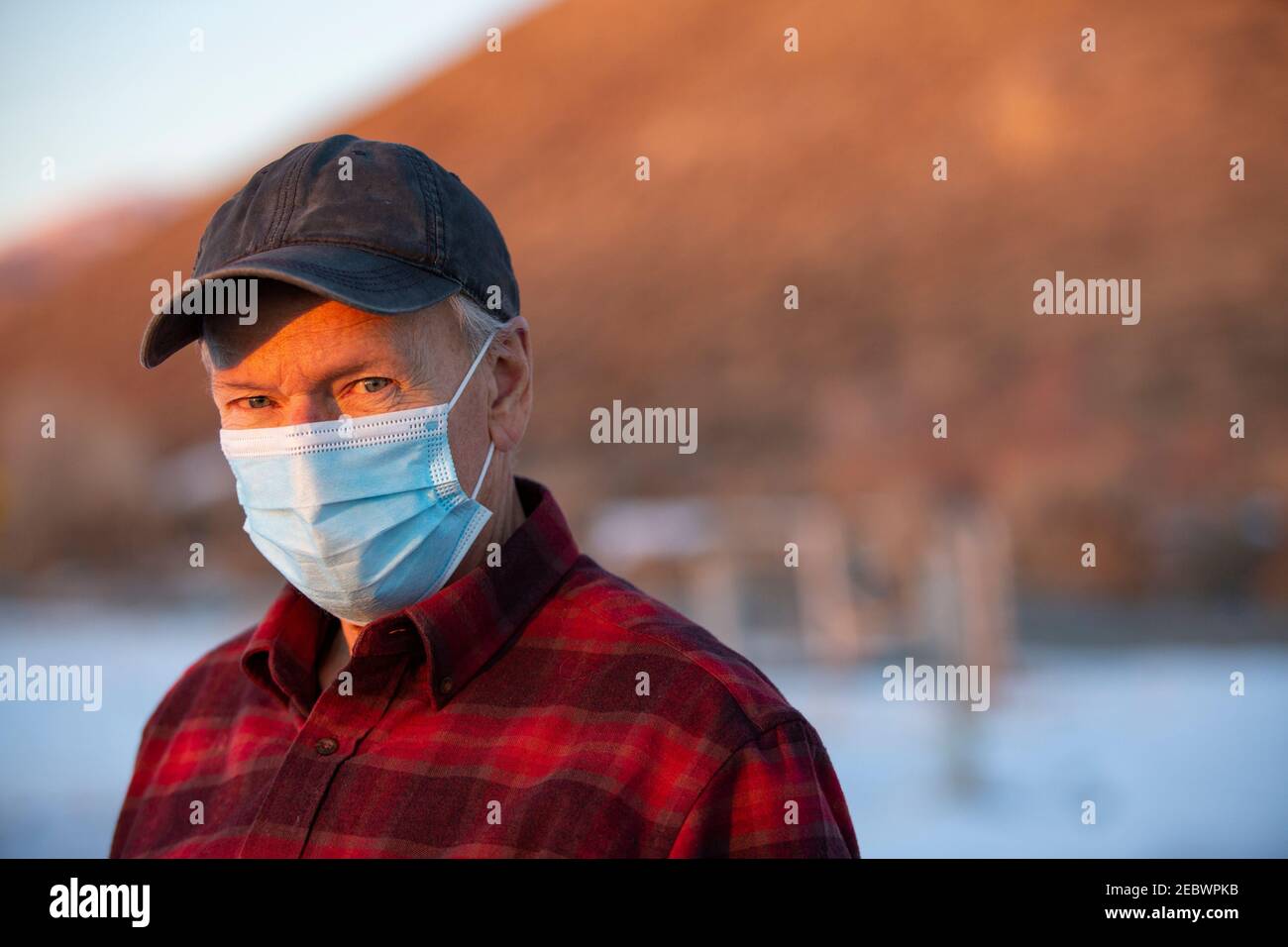 USA, Idaho, Bellevue, Outdoor portrait of senior man wearing COVID protective mask Stock Photo